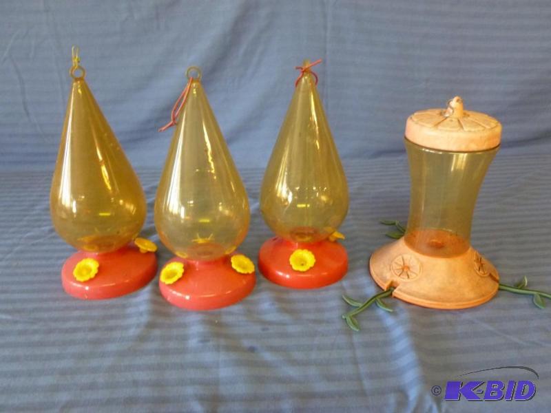 lot 113 image: Lot of four hummingbird feeders. ...