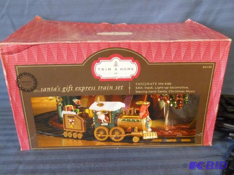 lot 123 image: Trim A Home Santas Gift Express Train Set, c...