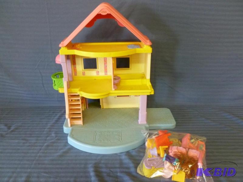 lot 124 image: Fisher Price plastic doll house with furnitur...