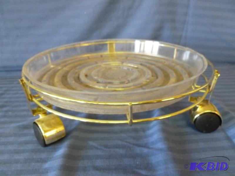 lot 138 image: Brass plated metal roller wheel plant stand w...