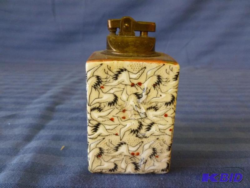 lot 163 image: Vintage Penguin brass and porcelain cigarette...