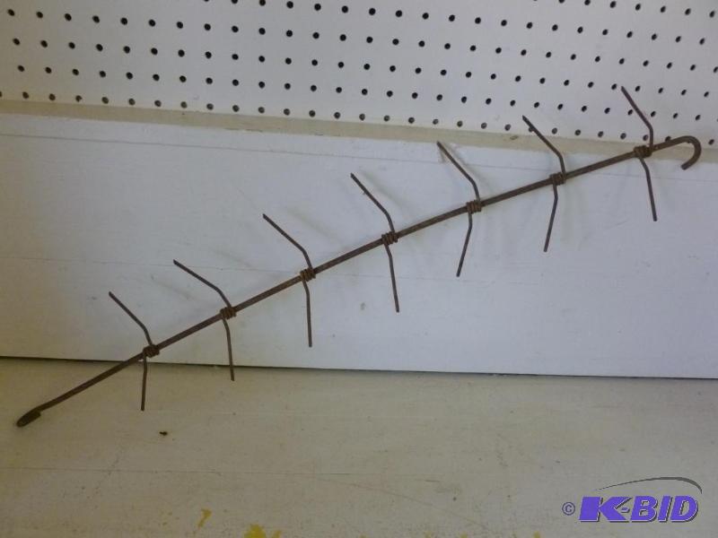 lot 59 image: Antique iron corn dryer, measures 29.5" ...