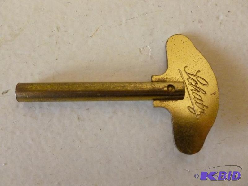 lot 79 image: Large Vintage Schatz&nbspbrass clock key, me...