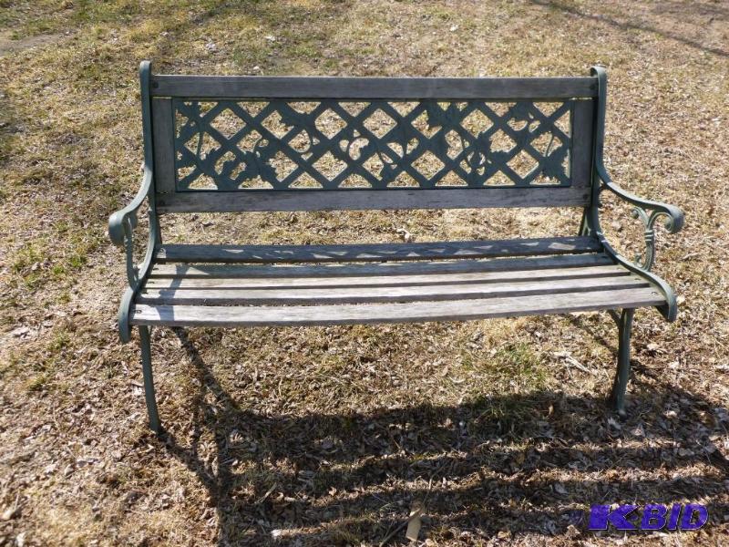 lot 9 image: Cast metal framed and wood outdoor bench that...