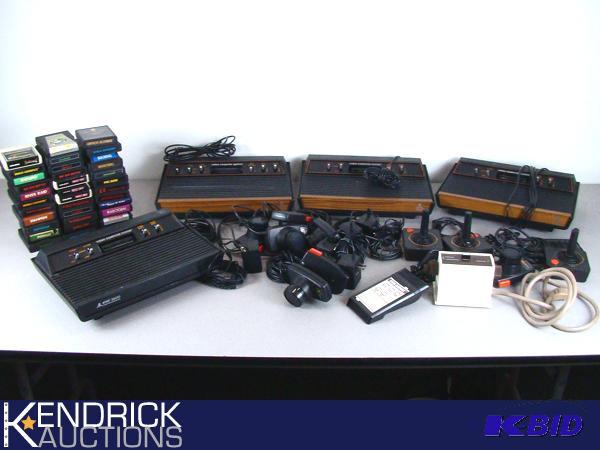 lot 13 image: 4 Vintage Atari Game Systems with Controllers, and Games