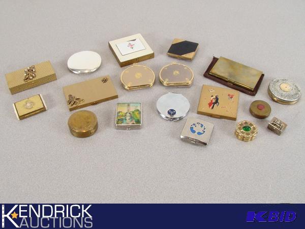 lot 39 image: Large Lot of Vintage Metal Compacts, Pill Boxes, and Coin Holders