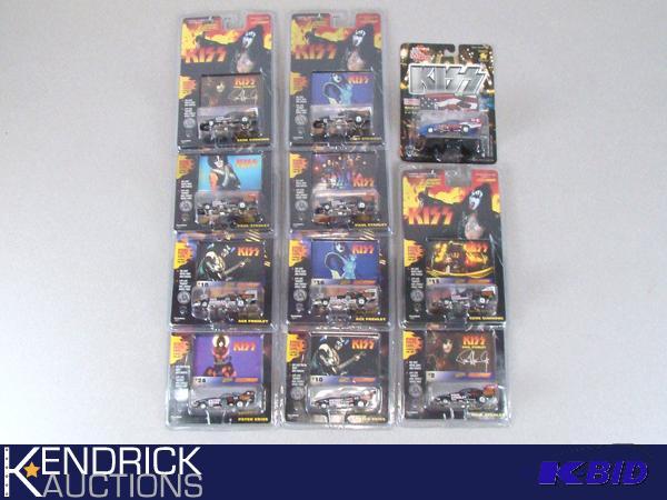 lot 6 image: 11 Vintage MINT ON CARD Johnny Lightning, and Racing Champions KISS Cars