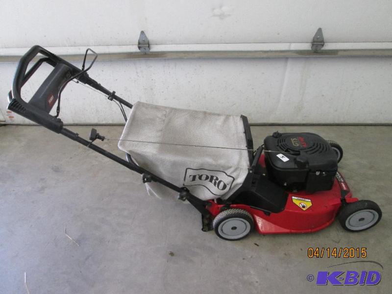 lot 5 image: Toro 6.5HP Personal Pace Lawn Mower With Bag ...