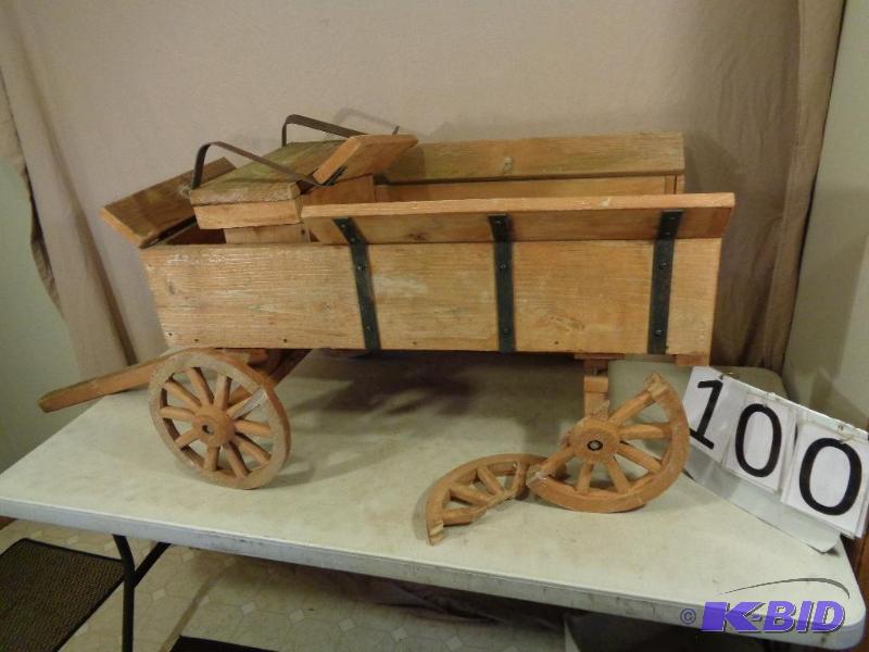 lot 100 image: Wood Lawn Wagon. One wheel is broken but can ...