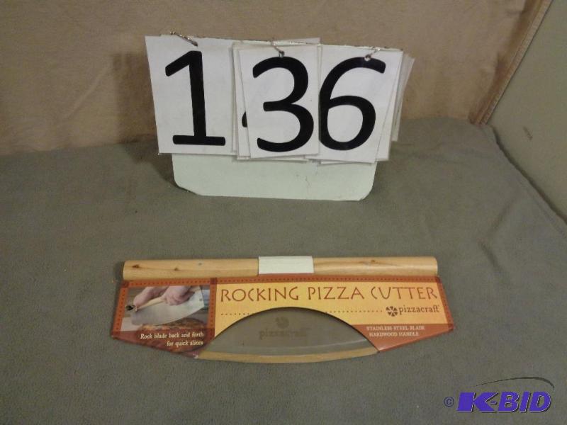 lot 136 image: New Display Model Rocking Pizza Cutter. Relis...