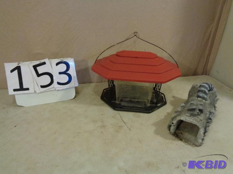lot 153 image: Hanging Bird Feeder and Raccoon Yard Decor....