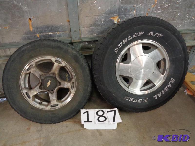 lot 187 image: 2 Aluminum Wheels with Tires. 16" GM 6 B...