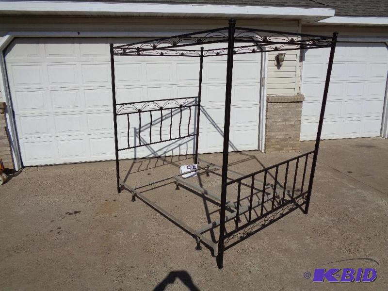 lot 55 image: Queen Sized Metal Canopy Bed. Comes with adju...