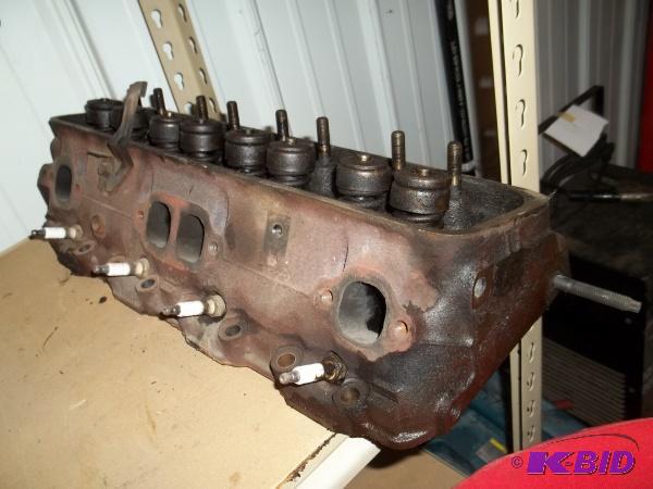 lot 26 image: 1990 Chevy 350 Cylinder head, no cracks....