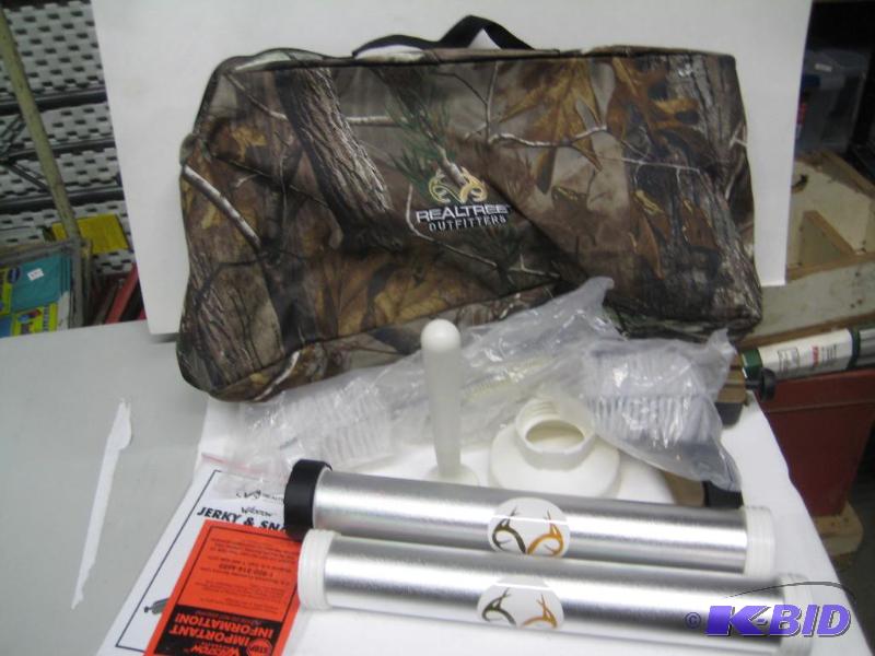 lot 137 image: New Realtree Outfitters brand sausage and jer...
