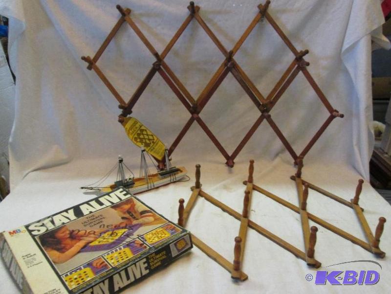 lot 212 image: lot of Stay Alive game laudry hangers and min...