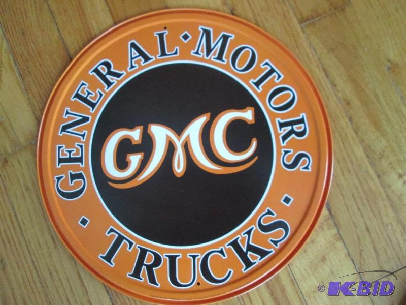 lot 63 image: GMC Trucks metal sign 12...