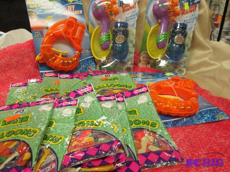 lot 64 image: water balloons, water shooters and bubble bli...