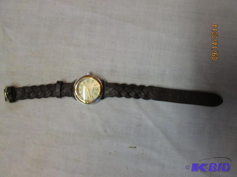lot 76 image: Ladies watch with braided leather band...