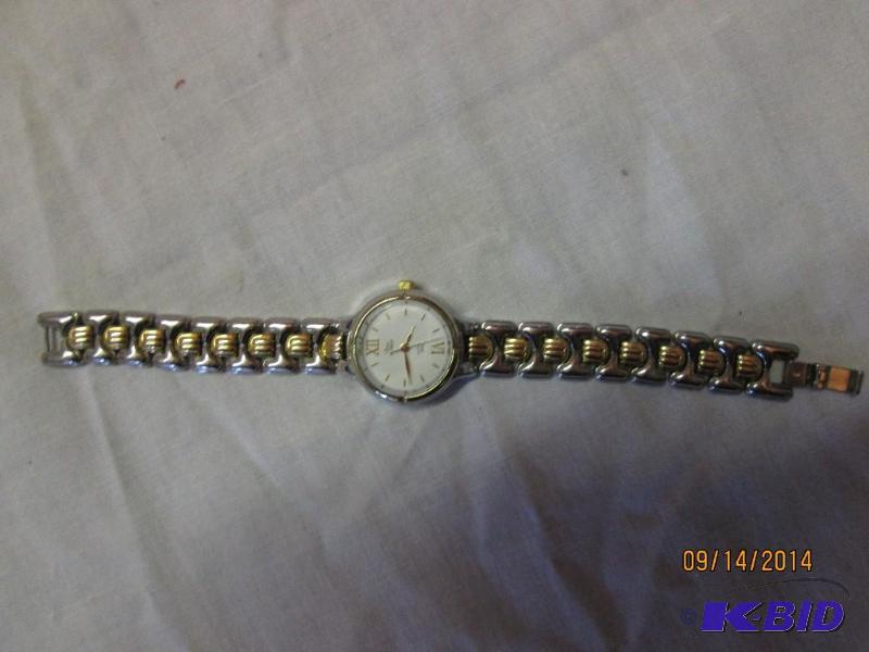 lot 78 image: Ladies watch with metal band...