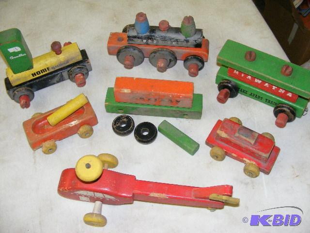 lot 181 image: wooden train cars and Playskool helicopter...