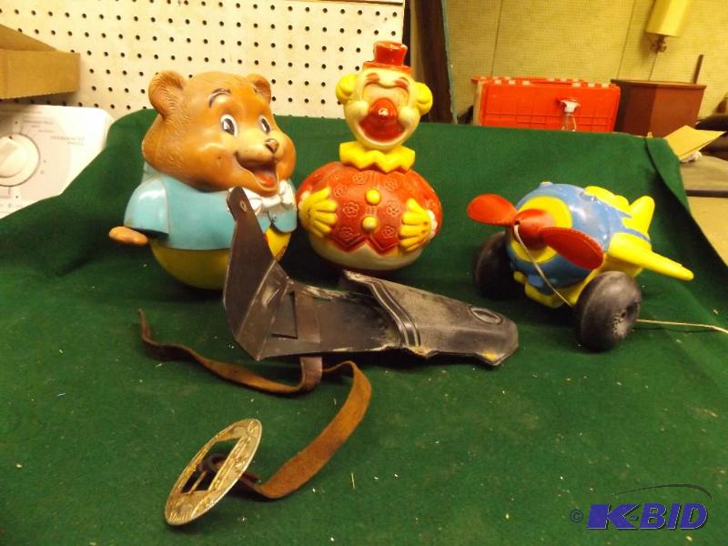lot 92 image: toy gun belt, roly poly toys, pull airplane...