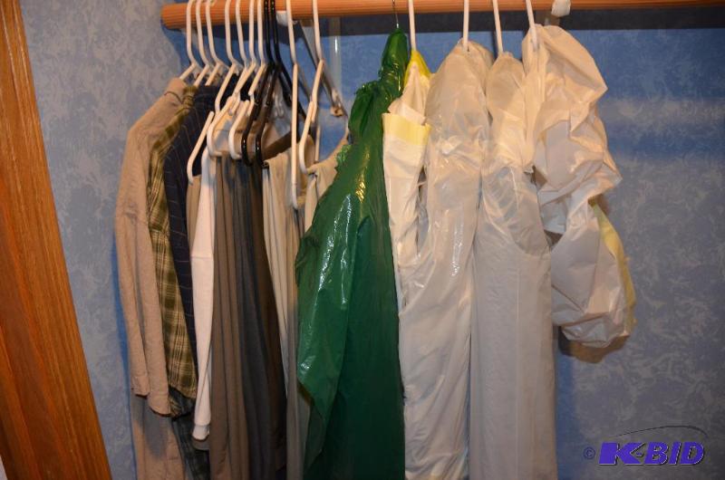lot 127 image: All clothes on rack, womens slacks, shirts a...