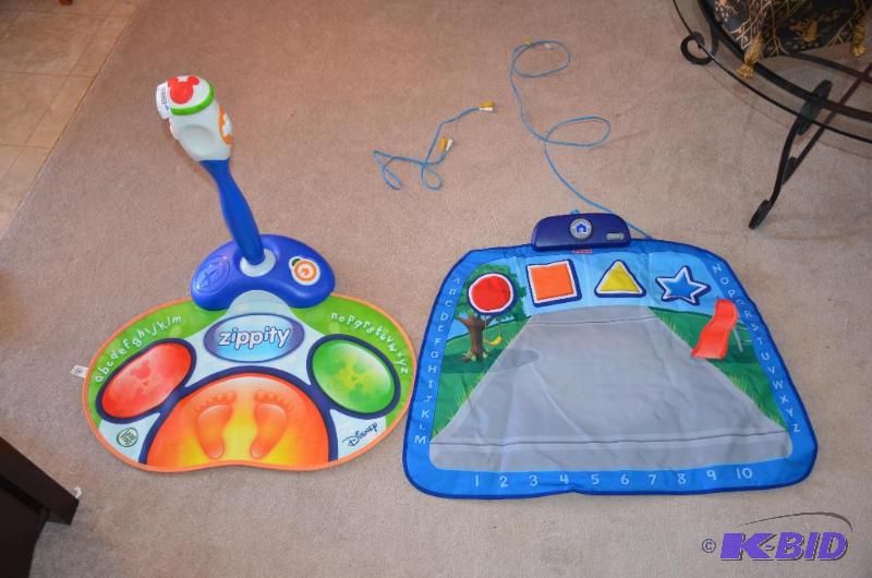 lot 151 image: Disney Zippety and Fisher Price game...