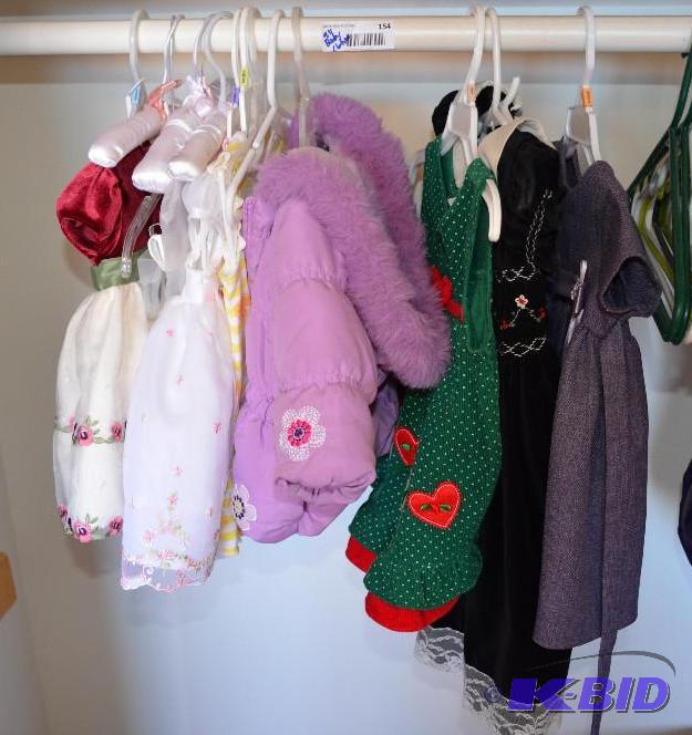 lot 154 image: All baby clothes on hangers, beautiful dresse...