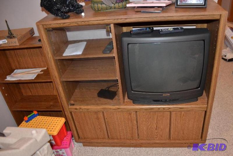 lot 99 image: TV entertainment center, 48x16x48, and a book...