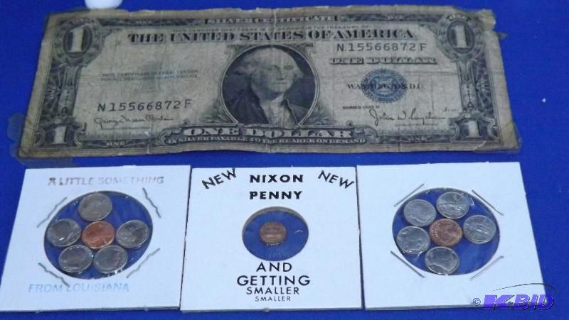 lot 203 image: 1935 D Silver Certificate with tape on the ed...