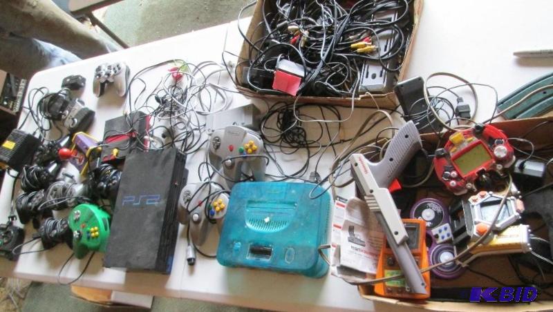 Lot of assorted video game controllersand ite...