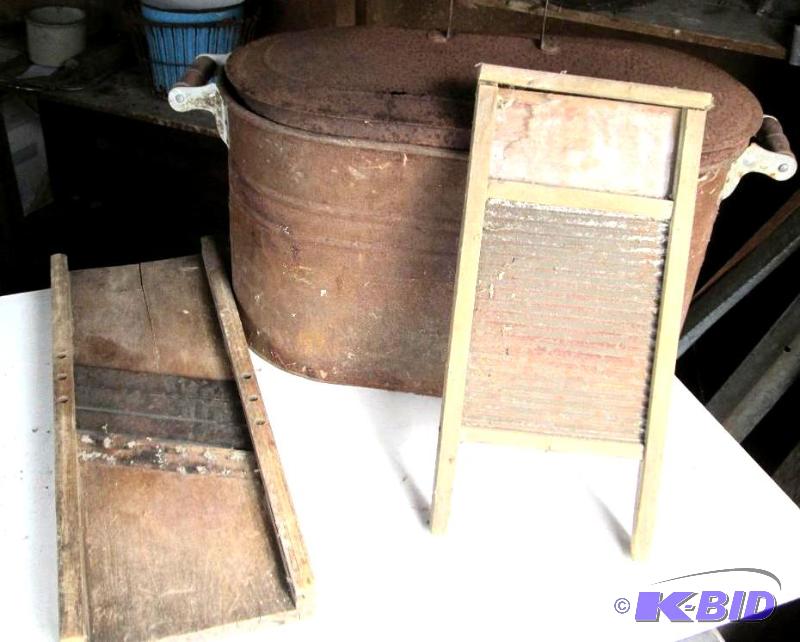 Antuque metal washtub, wash board, and a vege...