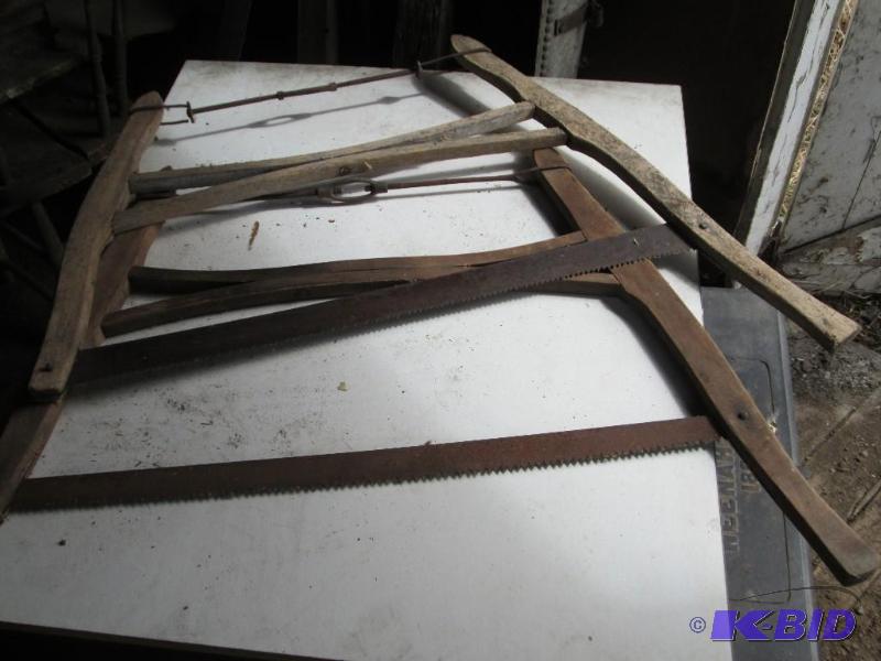 2 antique bow saws...
