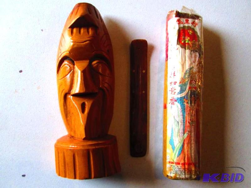 Large pack of Kun Yin incense and a wood face...