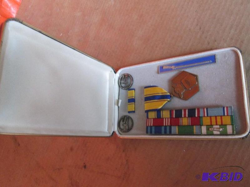 Vintage military medal and stripes in case...
