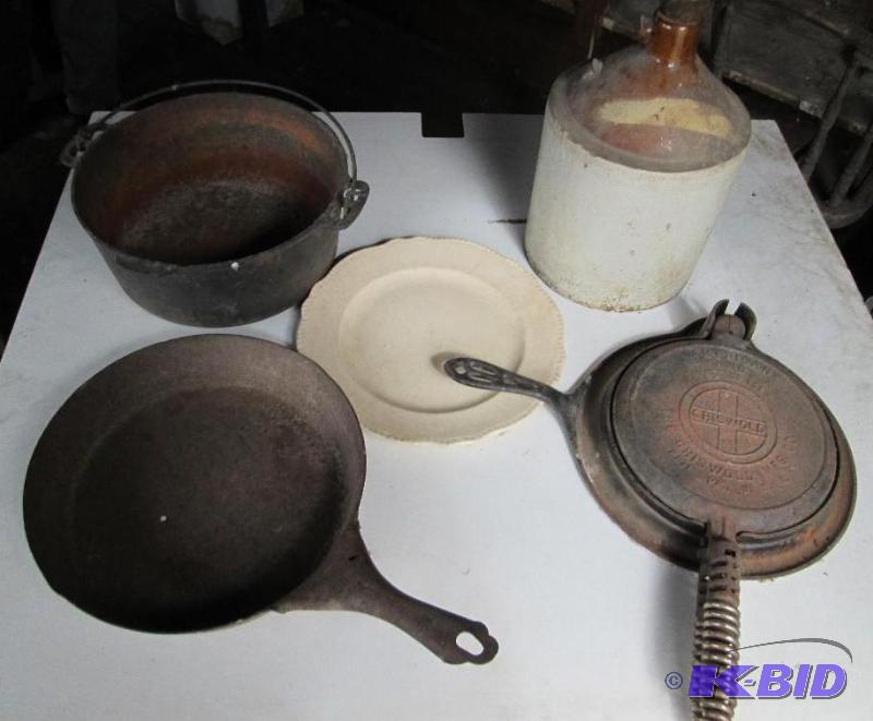Lot of antique cast iron cookware, including ...