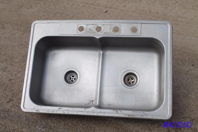lot 25 image: Double Stainless Steel Sink Measures 33"...