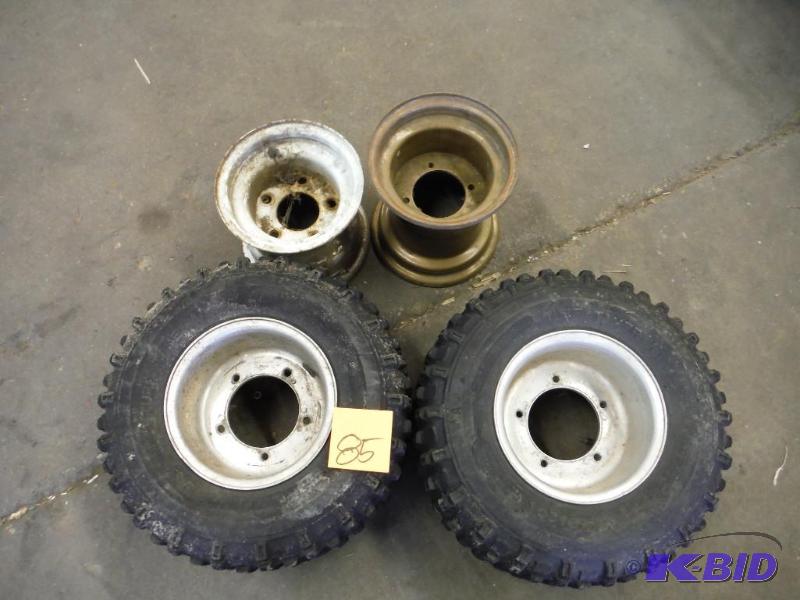 lot 85 image: 2 Suzuki 18x 11x 8 Rear Tires and rims1 Honda rear rim and 1 torsion Axle rim