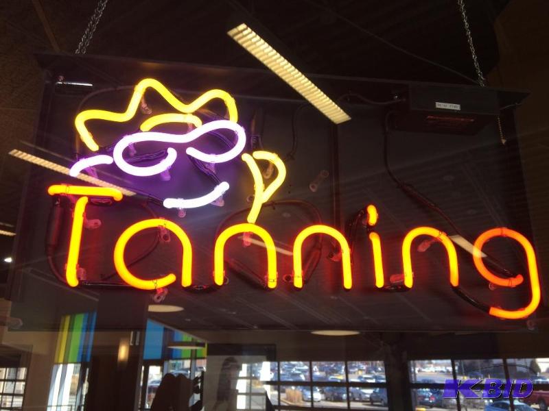 lot 15 image: Neon tanning sign