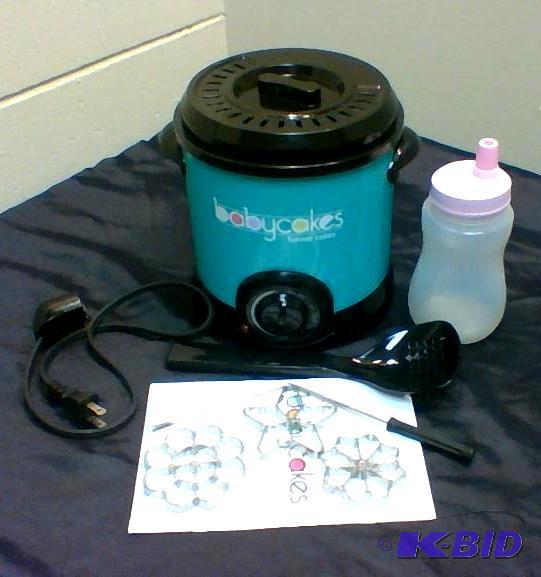 lot 20 image: Babycakes Mini Funnel Cake Fryer.  Customer Return.  Used.  Works. Powers on.