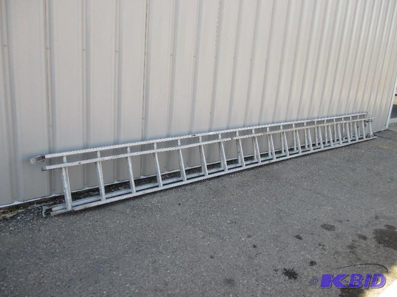 lot 104 image: 24 extension ladder, seperated into 2 pieces...