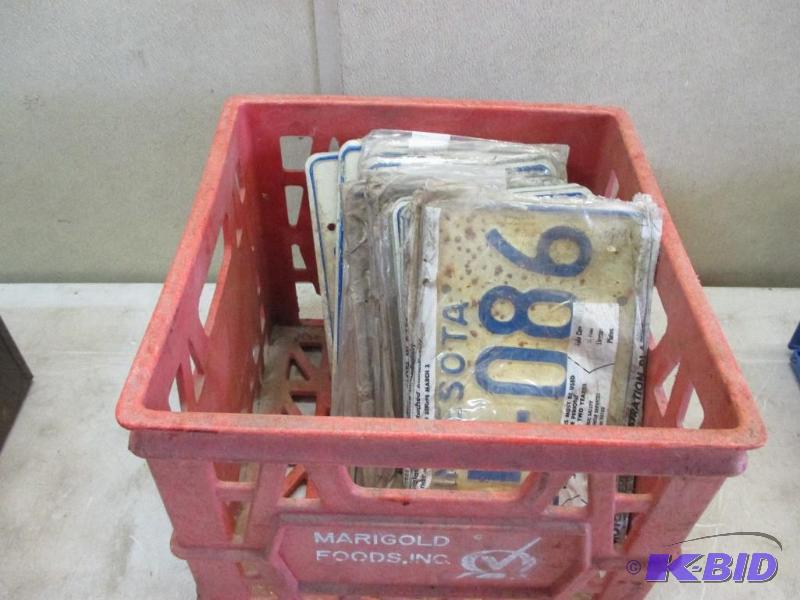 lot 61 image: tote of mostly new license plates...
