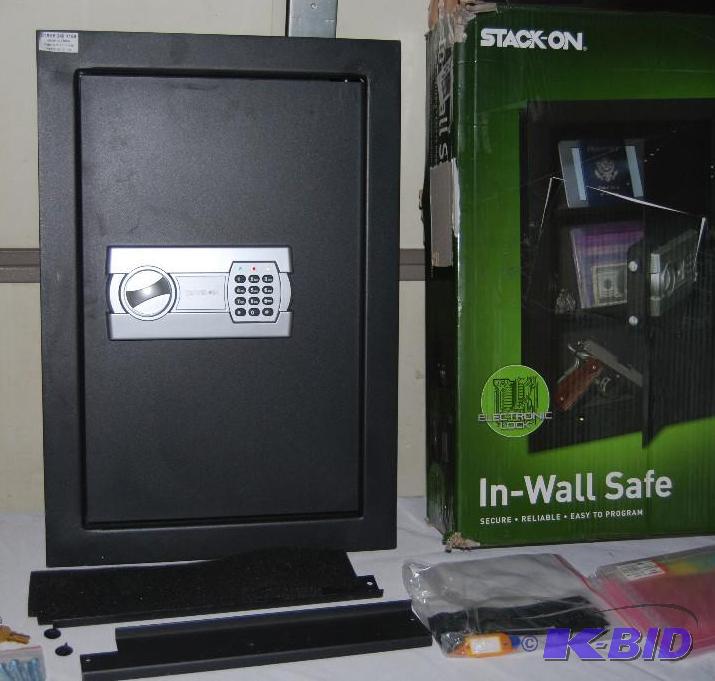 lot 53 image: Stack On Between Studs Wall Safe, solid steel...