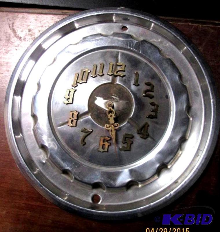 lot 195 image: Battery operated hubcap clock. Very unique...