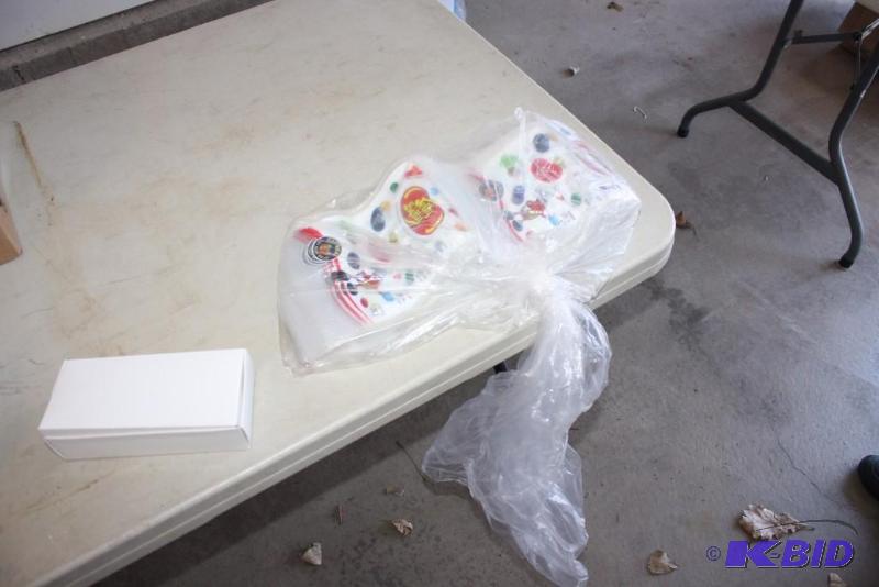 lot 42 image: Table Lot Including Jelly Belly Bags Cardboard Boxes.