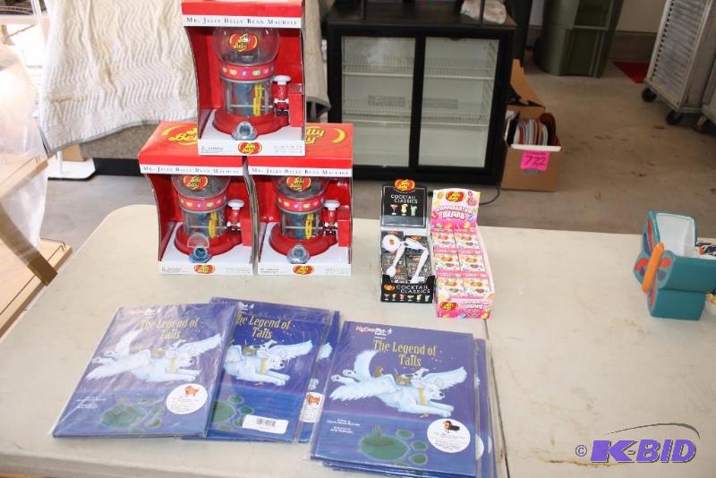 lot 43 image: Lot of (11) Including Jelly Belly Bean Dispensers Jelly Belly Boxes The Legend Of Tails Books.