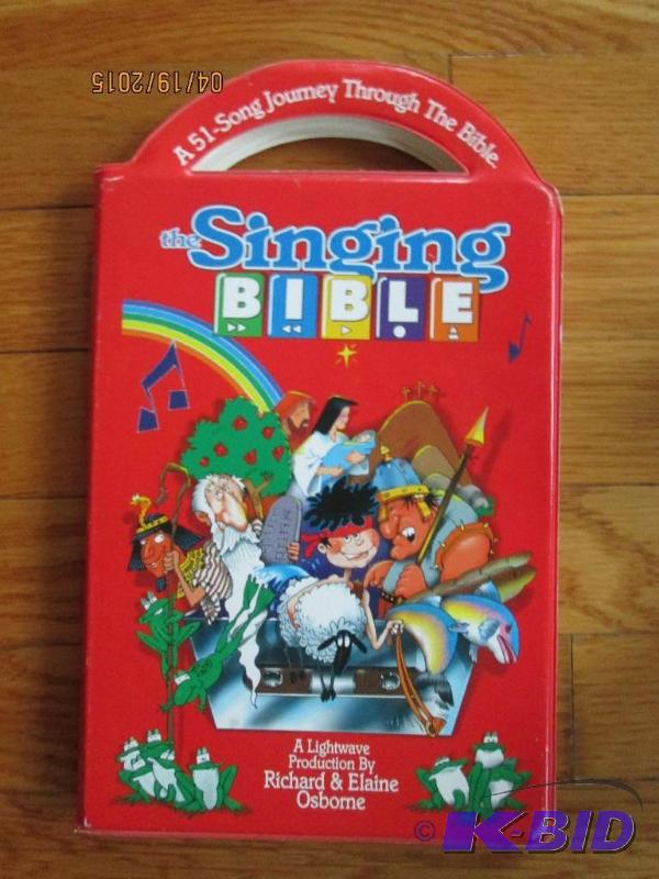 lot 74 image: The singing Bbile story song book...