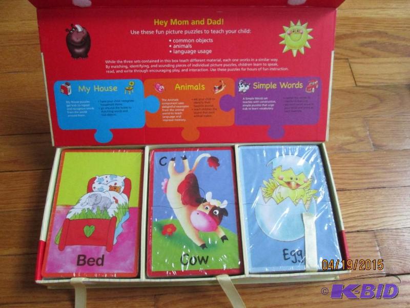 lot 76 image: First words puzzle set...