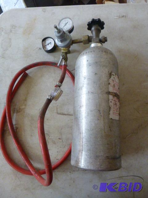 lot 106 image: CO2 Tank with Gauge Plastic cover is missing....